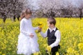 Boy giving girl flowers Royalty Free Stock Photo