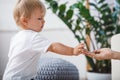 Boy giving hand for her mother