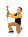 Boy giving rose flower isolated