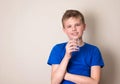 Boy with glass of water with copyspace. Smiling teenage Royalty Free Stock Photo