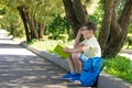 The boy in glasses, in the open air thought about the read