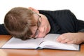 Boy in glasses sleeps on book