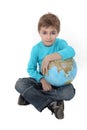 Boy with a globe in his lap Royalty Free Stock Photo