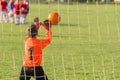 Boy goalkeeper defends