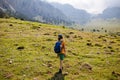 boy goes with a backpack on the background of the mountains. child traveler with backpack, travel, lifestyle concept