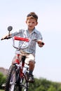 Boy goes for a drive on a bicycle