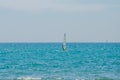 ROMA, ITALY - JULY 2017: The boy goes windsurfing on the Tyrrhenian Sea near Ostia, Italy Royalty Free Stock Photo