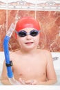 Boy in goggles and cap with snorkel Royalty Free Stock Photo