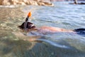 Boy in goggles and pipe diving in sea Royalty Free Stock Photo