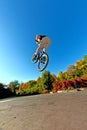 Boy going airborne with his dirt bike Royalty Free Stock Photo