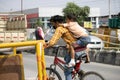 A Boy going on bicyle with his injured little brother