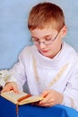 Boy going to the first holy communion with prayer Royalty Free Stock Photo