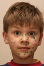 Boy with Green Dots Royalty Free Stock Photo