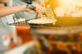 The boy grilling dough sheet