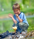 Boy grilling sausages Royalty Free Stock Photo