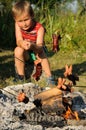 Boy grilling sausages Royalty Free Stock Photo