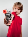 Boy with gun toy Royalty Free Stock Photo