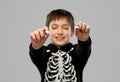 Boy in halloween costume with eyeball candies Royalty Free Stock Photo