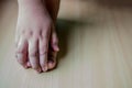 hand and feet are on the wooden floor Royalty Free Stock Photo