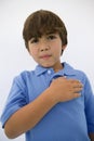 Boy With Hand On Heart Royalty Free Stock Photo