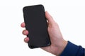 Boy hand holding black modern smartphone with empty screen, isolated on white background. Mockup Royalty Free Stock Photo