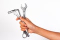 Boy hand holding a wrench isolated on a white. Royalty Free Stock Photo