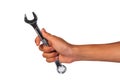 Boy hand holding a wrench isolated on a white. Royalty Free Stock Photo