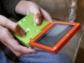 Boy and handheld video game close up Royalty Free Stock Photo