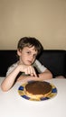 Boy and handmade cake, person sign