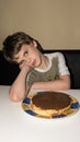 Boy and handmade cake, pie person