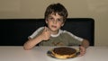 Boy and handmade cake, pie person