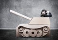 Boy in handmade cardboard panzer.