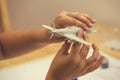 Boy hands assembling plastic model kit of ww2 aircraft 2