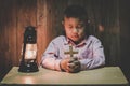 Boy hands holding a holy cross and praying to God, Child Praying for God Religion Royalty Free Stock Photo