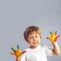 Boy with hands painted in colorful paints Royalty Free Stock Photo