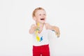 Boy with hands painted in colorful paints ready to make hand prints. School. Preschool. Education. Creativity. Studio portrait Royalty Free Stock Photo