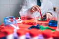 Boy hands playing to be chemist with colorful liquids Royalty Free Stock Photo