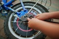 Boy hands repair bike. Little mechanic work with bicycle Royalty Free Stock Photo