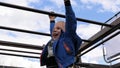 Boy hanging on monkey bars Royalty Free Stock Photo