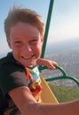Boy with happy face on ferris wheel