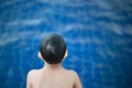 Boy happy swimming in a pool. Happy child playing in swimming pool. Summer vacation concept