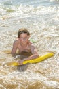 Boy has fun jumping in the waves Royalty Free Stock Photo