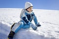 Boy has fun in the mountains, winter fun Royalty Free Stock Photo