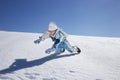 Boy has fun in the mountains, winter fun Royalty Free Stock Photo