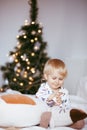 A boy has fun, plays like a doctor, treats his cat with a toy and puts drops in his nose Royalty Free Stock Photo