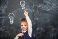 The boy has an idea drawn on the Board light bulb Royalty Free Stock Photo