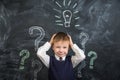 The boy has an idea drawn on the Board light bulb Royalty Free Stock Photo