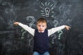 The boy has an idea drawn on the Board light bulb Royalty Free Stock Photo