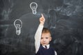 The boy has an idea drawn on the Board light bulb Royalty Free Stock Photo