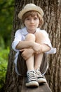 Boy in the hat on the bench Royalty Free Stock Photo